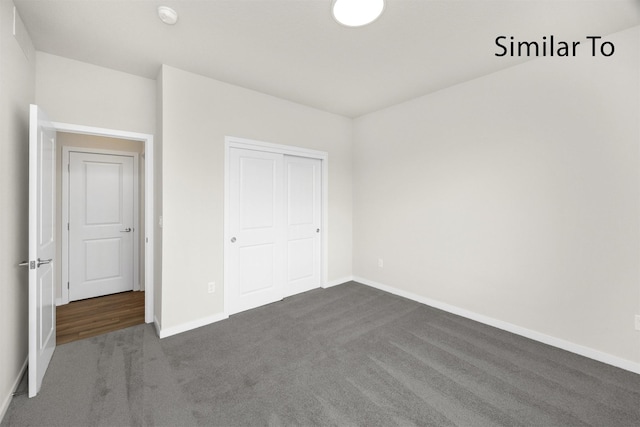 16732 Walnut Meadows Cir, Urbandale, IA 50323 - unfurnished bedroom with dark colored carpet and a closet
