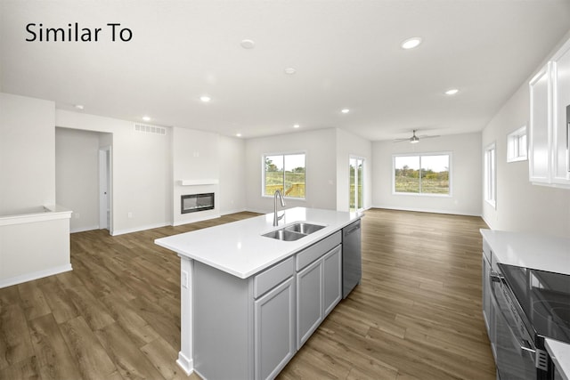 16738 Walnut Meadows Cir, Urbandale, IA 50323 - kitchen with open floor plan, range with electric cooktop, stainless steel dishwasher, light countertops, and recessed lighting