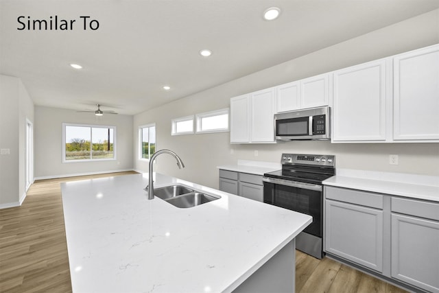 16738 Walnut Meadows Cir, Urbandale, IA 50323 - kitchen featuring stainless steel appliances, gray cabinetry, ceiling fan, recessed lighting, and light wood-style flooring