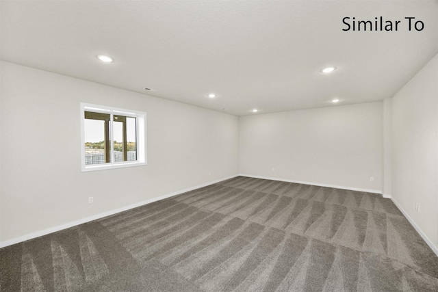 16738 Walnut Meadows Cir, Urbandale, IA 50323 - empty room featuring dark colored carpet and recessed lighting