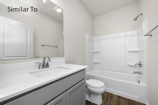 16738 Walnut Meadows Cir, Urbandale, IA 50323 - full bathroom with vanity, wood finished floors, and tub / shower combination