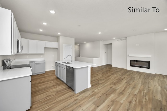16738 Walnut Meadows Cir, Urbandale, IA 50323 - kitchen with stainless steel appliances, recessed lighting, light wood-type flooring, light countertops, and open floor plan