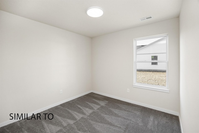 2212 Legacy Dr, Norwalk, IA 50211 - empty room featuring dark carpet and baseboards