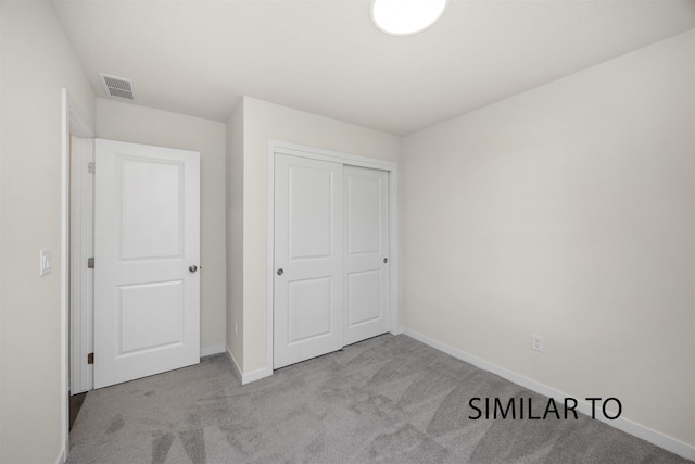 2212 Legacy Dr, Norwalk, IA 50211 - unfurnished bedroom with carpet flooring and a closet