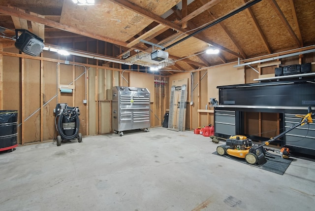 604 W 2nd Ave, Indianola, IA 50125 - garage featuring a garage door opener