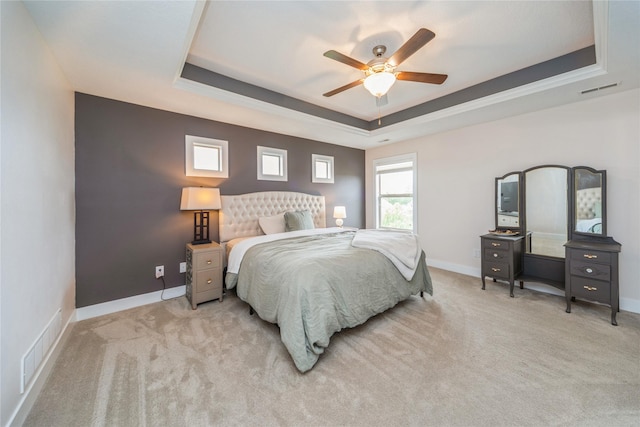 16823 Prairie Dr, Clive, IA 50325 - carpeted bedroom with a raised ceiling and ceiling fan
