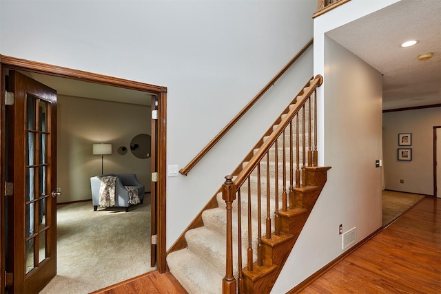 2216 NW 136th St, Clive, IA 50325 - stairway with wood finished floors and recessed lighting