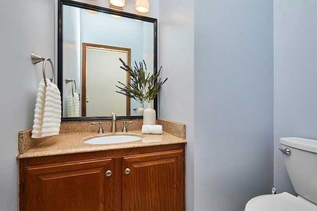 2216 NW 136th St, Clive, IA 50325 - bathroom featuring vanity and toilet