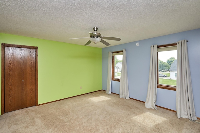 2216 NW 136th St, Clive, IA 50325 - unfurnished bedroom featuring light colored carpet and a ceiling fan