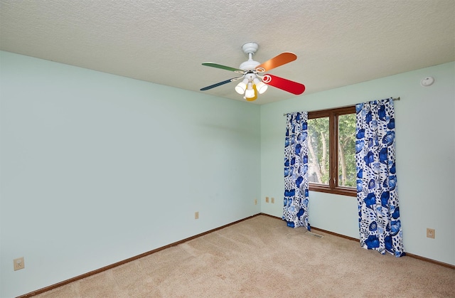 2216 NW 136th St, Clive, IA 50325 - carpeted empty room featuring ceiling fan, a smoke detector, and a textured ceiling