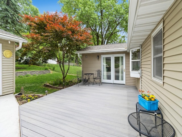 312 N J St, Indianola, IA 50125 - wooden terrace featuring french doors and a lawn