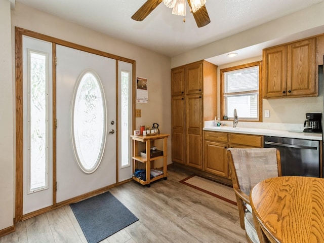 312 N J St, Indianola, IA 50125 - entryway with a ceiling fan and light wood-style flooring