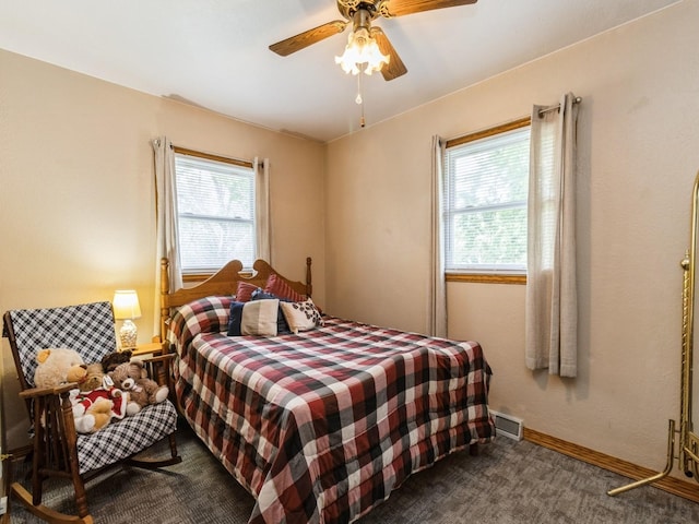 312 N J St, Indianola, IA 50125 - bedroom featuring multiple windows, carpet floors, and a ceiling fan
