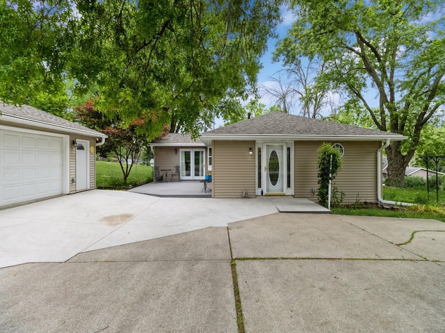 312 N J St, Indianola, IA 50125 - single story home with french doors and concrete driveway
