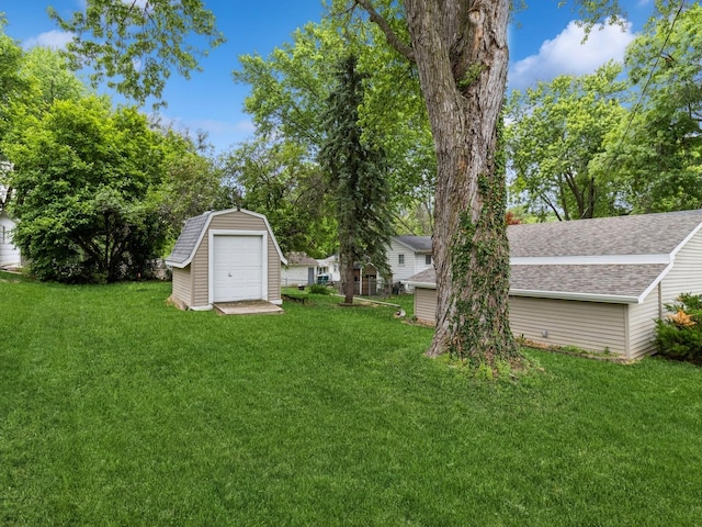 312 N J St, Indianola, IA 50125 - view of green lawn with a storage shed