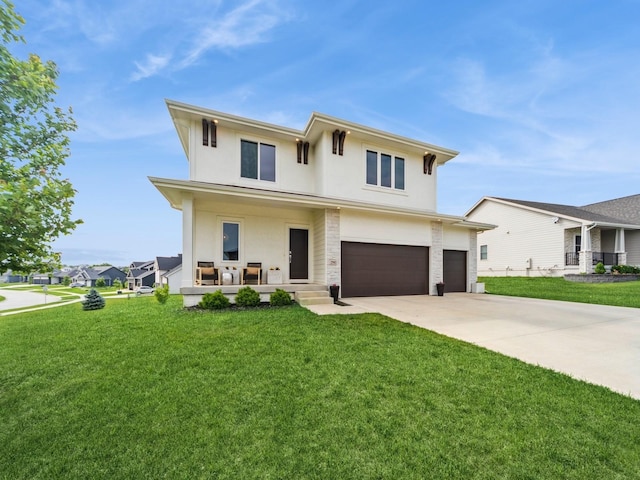 2502 Blooming Heights Dr, Norwalk, IA 50211 - view of front of house with stucco siding, an attached garage, concrete driveway, a porch, and a front yard