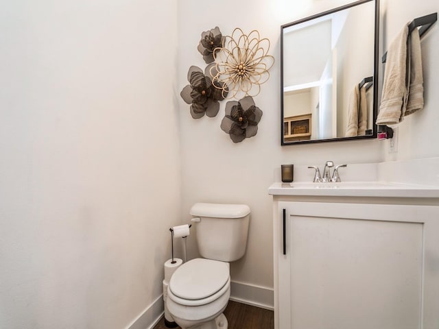 2502 Blooming Heights Dr, Norwalk, IA 50211 - half bathroom featuring vanity and wood finished floors