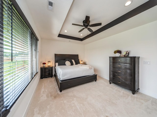 2502 Blooming Heights Dr, Norwalk, IA 50211 - bedroom with light colored carpet, recessed lighting, a raised ceiling, and ceiling fan