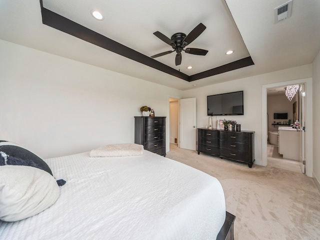 2502 Blooming Heights Dr, Norwalk, IA 50211 - bedroom with light colored carpet, recessed lighting, a tray ceiling, and a ceiling fan