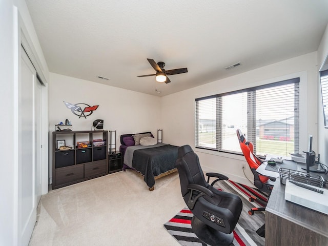 2502 Blooming Heights Dr, Norwalk, IA 50211 - bedroom with carpet, an office area, a closet, and ceiling fan