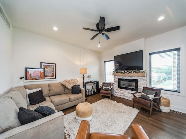 2502 Blooming Heights Dr, Norwalk, IA 50211 - living room featuring healthy amount of natural light, dark wood-style floors, a fireplace, and recessed lighting