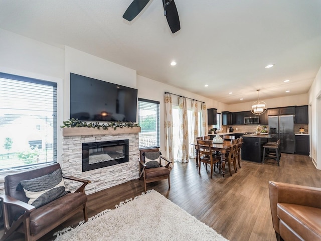 2502 Blooming Heights Dr, Norwalk, IA 50211 - living area with a ceiling fan, wood finished floors, a stone fireplace, and recessed lighting