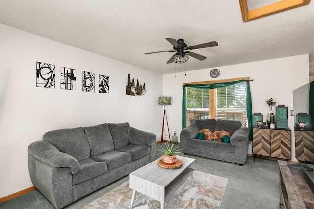 1334 E 13th St, Des Moines, IA 50316 - carpeted living room with ceiling fan and a textured ceiling