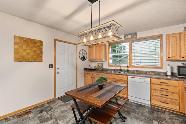 1334 E 13th St, Des Moines, IA 50316 - kitchen with dishwasher, dark countertops, stainless steel microwave, pendant lighting, and light brown cabinets