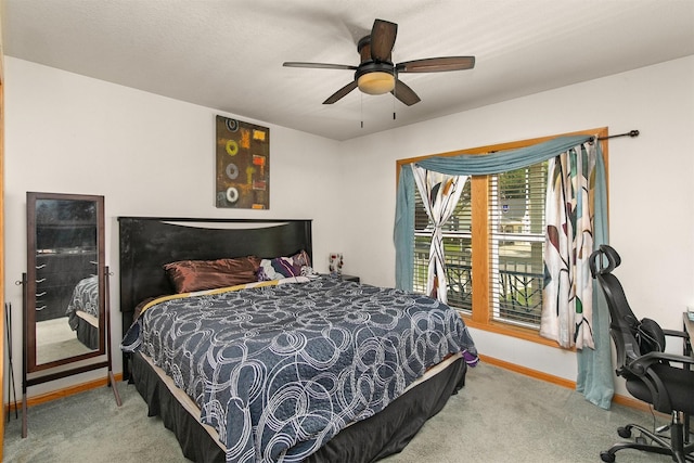 1334 E 13th St, Des Moines, IA 50316 - carpeted bedroom featuring ceiling fan and an office area