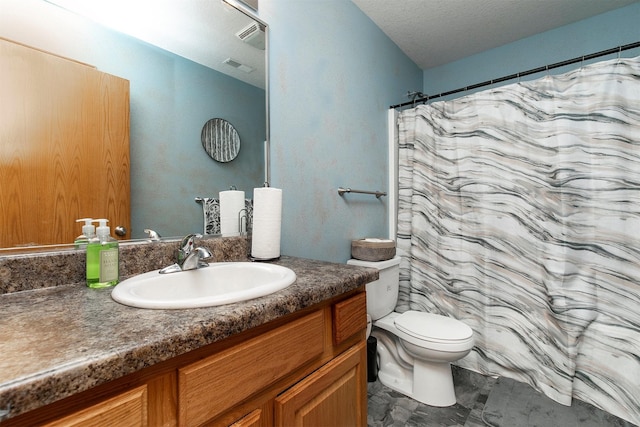 1334 E 13th St, Des Moines, IA 50316 - bathroom with vanity and a textured ceiling