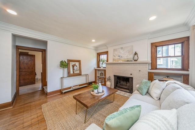 620 48th St, Des Moines, IA 50312 - living area featuring ornamental molding, a fireplace, light wood finished floors, and recessed lighting