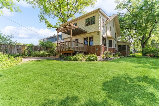 620 48th St, Des Moines, IA 50312 - rear view of house with brick siding and a wooden deck