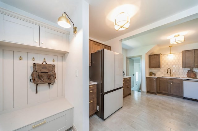 620 48th St, Des Moines, IA 50312 - mudroom with a sink and light wood-type flooring