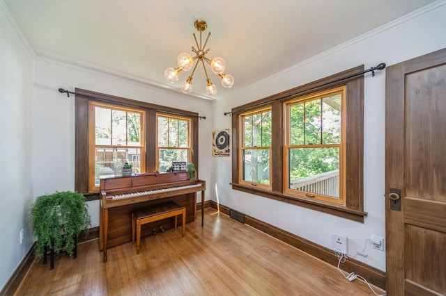 620 48th St, Des Moines, IA 50312 - sitting room featuring wood finished floors, a chandelier, and ornamental molding