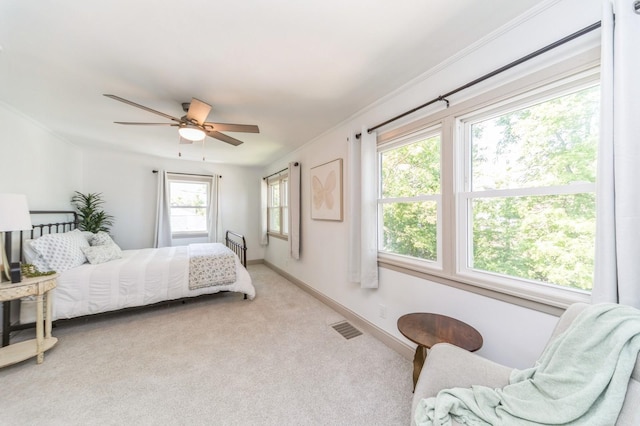 620 48th St, Des Moines, IA 50312 - bedroom featuring light carpet, ceiling fan, and crown molding