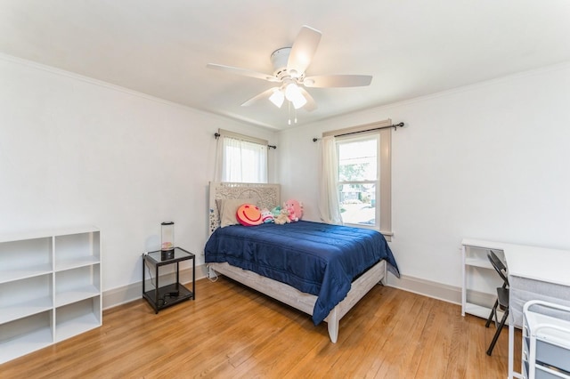 620 48th St, Des Moines, IA 50312 - bedroom with light wood finished floors, ornamental molding, and a ceiling fan