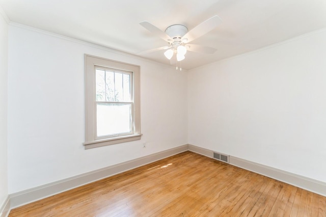 620 48th St, Des Moines, IA 50312 - spare room with light wood finished floors, ornamental molding, and a ceiling fan