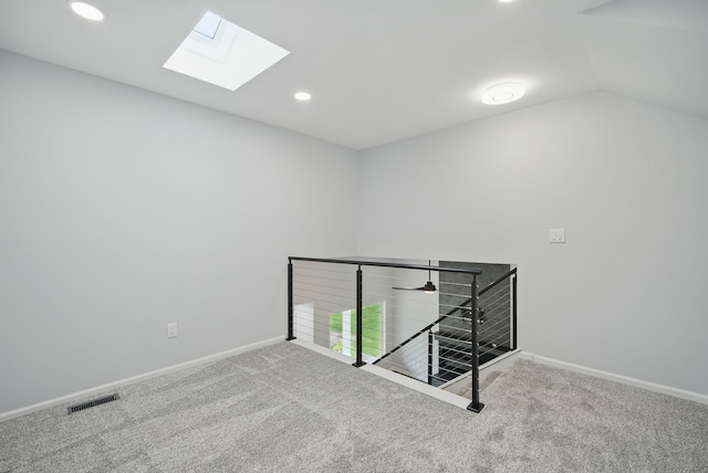 4510 89th St, Urbandale, IA 50322 - empty room with a skylight, carpet, recessed lighting, and lofted ceiling