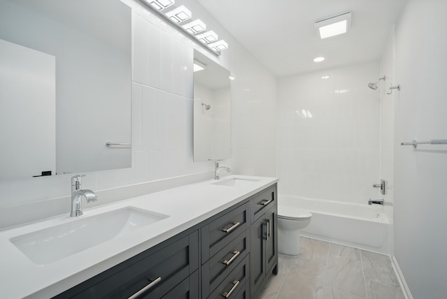 4510 89th St, Urbandale, IA 50322 - full bathroom featuring double vanity,  shower combination, and marble finish flooring