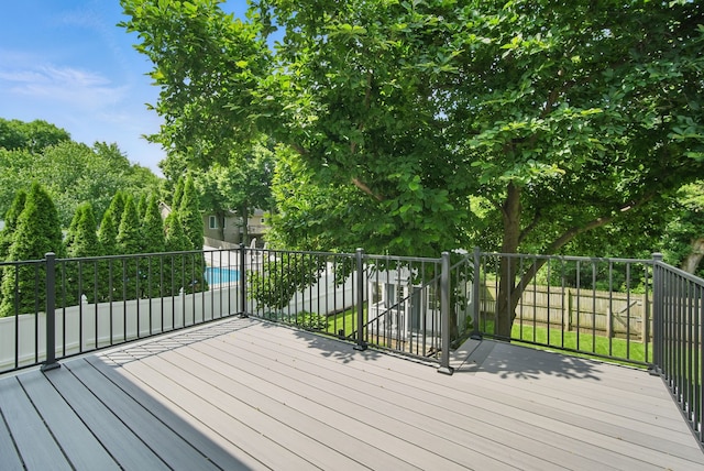 4510 89th St, Urbandale, IA 50322 - wooden deck with view of scattered trees