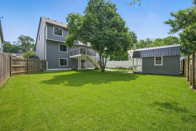 4510 89th St, Urbandale, IA 50322 - fenced backyard with stairway, a storage unit, and a deck