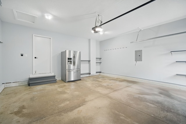 4510 89th St, Urbandale, IA 50322 - garage with stainless steel fridge, electric panel, and a garage door opener