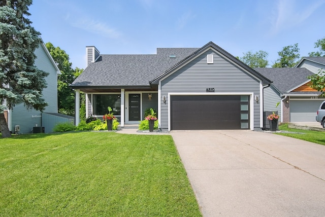 4510 89th St, Urbandale, IA 50322 - view of front of property with a garage, a front yard, a shingled roof, driveway, and a chimney