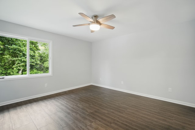 4510 89th St, Urbandale, IA 50322 - unfurnished room with ceiling fan and dark wood-type flooring