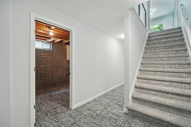 4510 89th St, Urbandale, IA 50322 - stairs with carpet floors and brick wall
