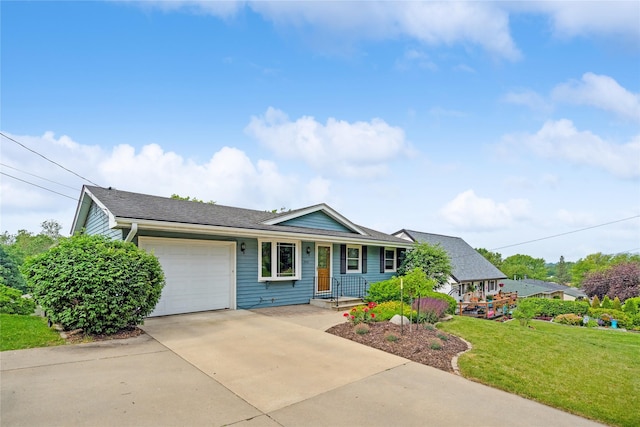 2441 Hull Ave, Des Moines, IA 50317 - ranch-style house with an attached garage, a front yard, and driveway
