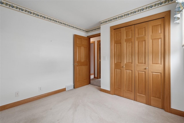 2441 Hull Ave, Des Moines, IA 50317 - unfurnished bedroom with carpet flooring and a closet