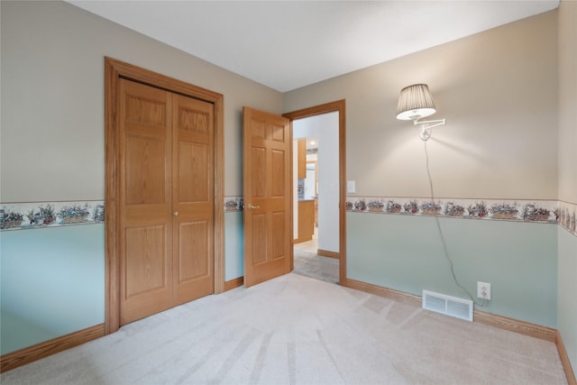 2441 Hull Ave, Des Moines, IA 50317 - unfurnished bedroom with carpet flooring and a closet