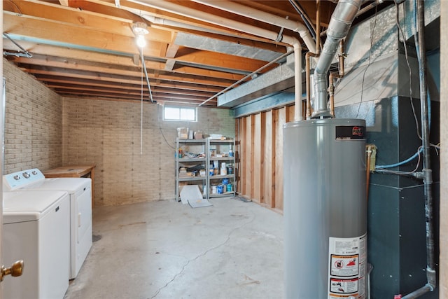 2441 Hull Ave, Des Moines, IA 50317 - below grade area with water heater, separate washer and dryer, and brick wall
