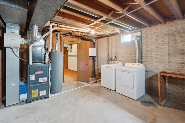 2441 Hull Ave, Des Moines, IA 50317 - basement with water heater, separate washer and dryer, brick wall, and heating unit